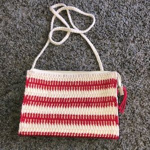 Very unique clutch purse with removable Crossbody strap. With knit overlay